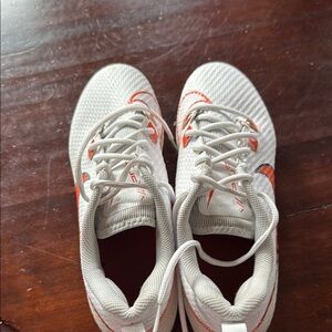 White and Orange Athletic Shoes